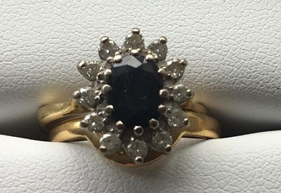 Fitted Wedding Ring next to Sapphire and Diamond Engagement Ring